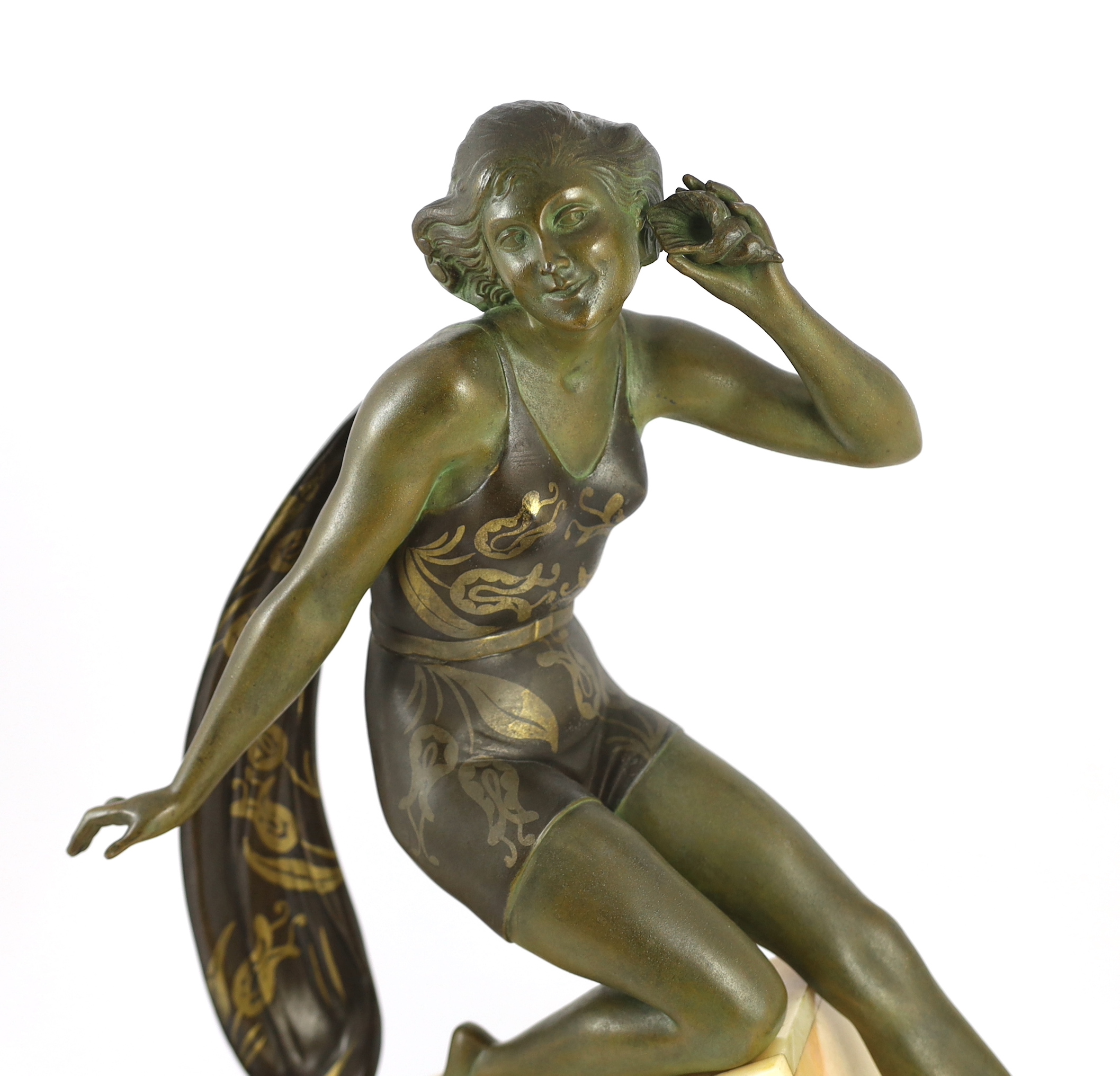 A French Art Deco bronzed spelter and marble figure of a bathing beauty, 58cm wide, 15cm deep, 53cm high